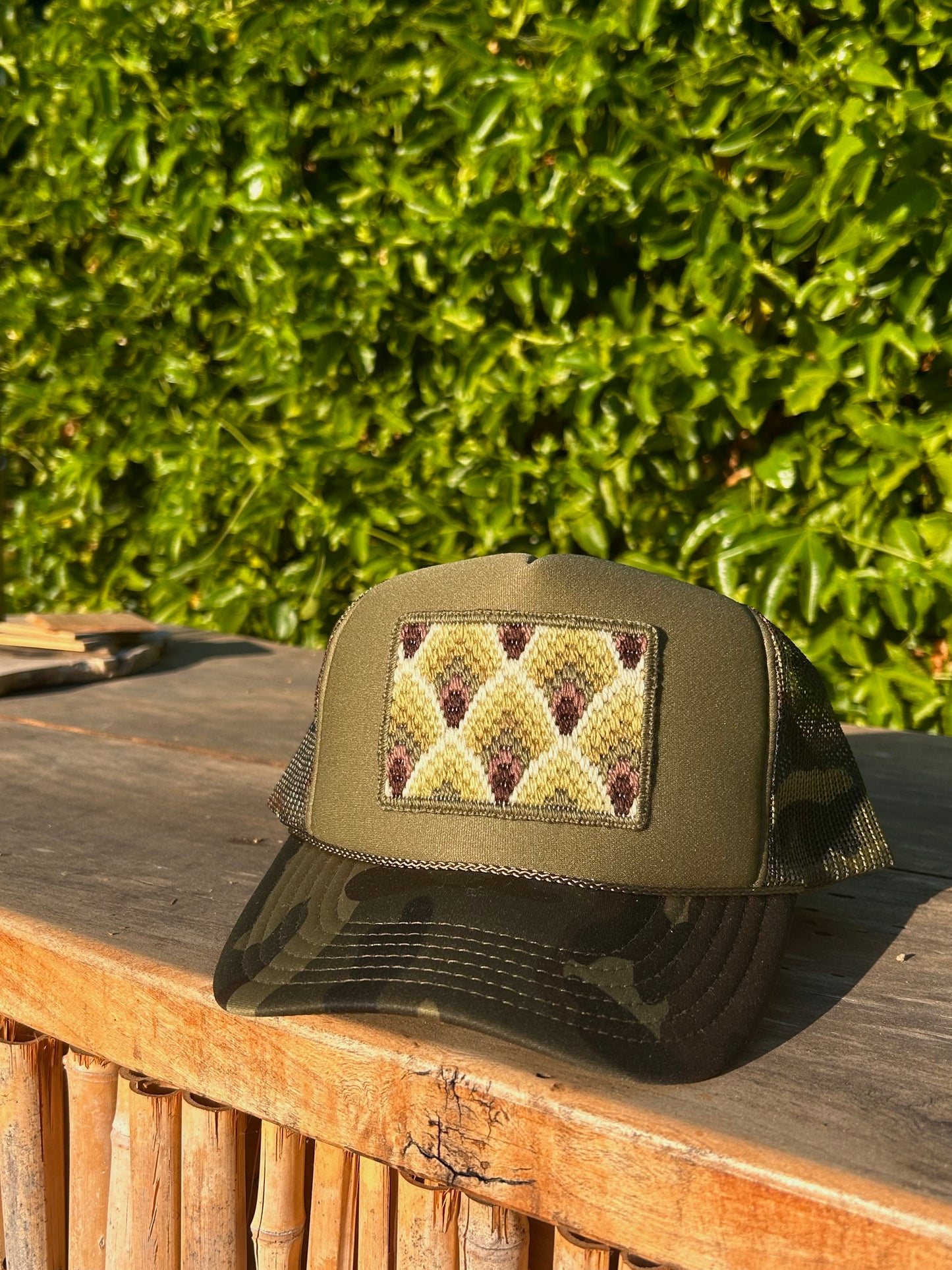 Green Feathers on Olive Camo